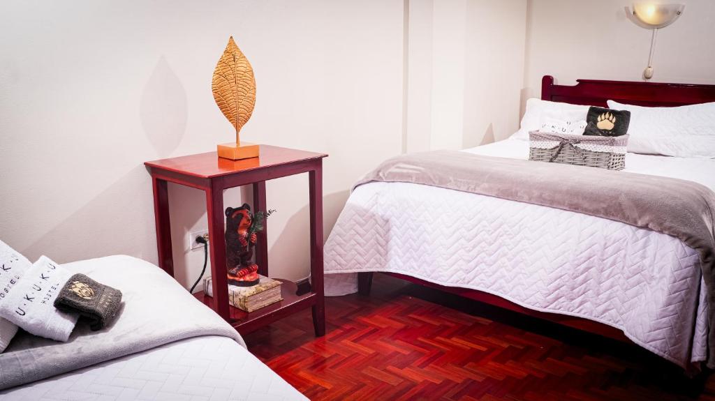Postel nebo postele na pokoji v ubytování UKUKU Hostel