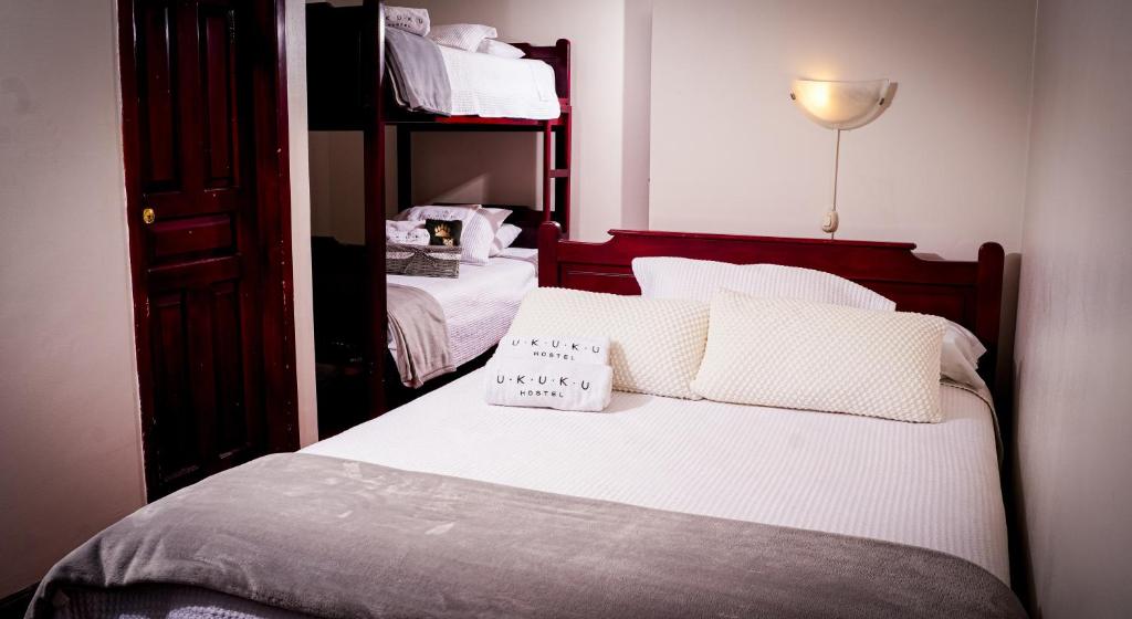 Postel nebo postele na pokoji v ubytování UKUKU Hostel