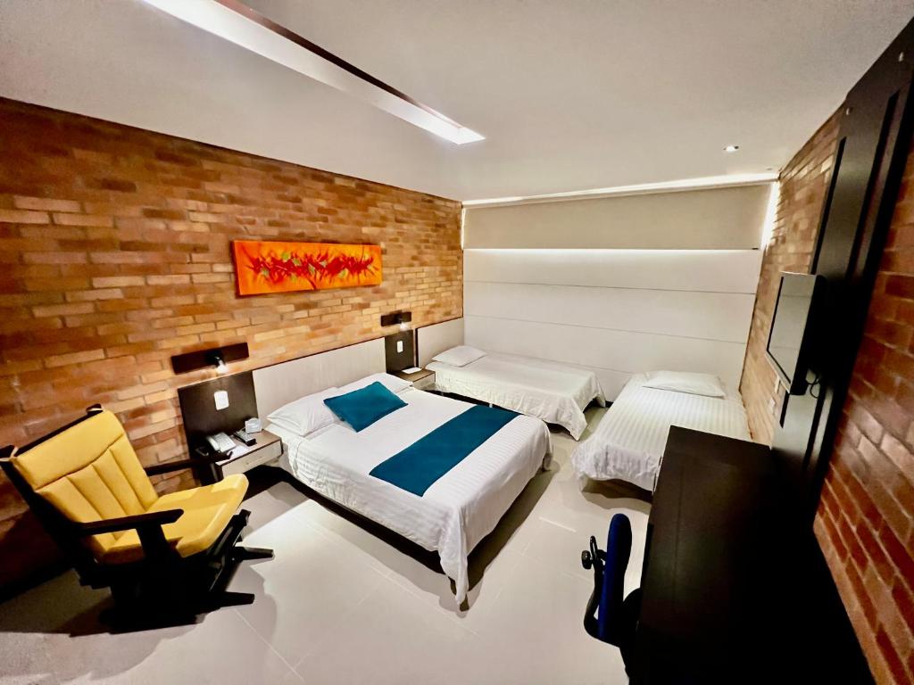 Postel nebo postele na pokoji v ubytování Hotel Toscana Oriente