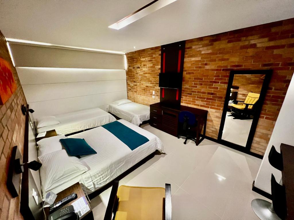 Postel nebo postele na pokoji v ubytování Hotel Toscana Oriente