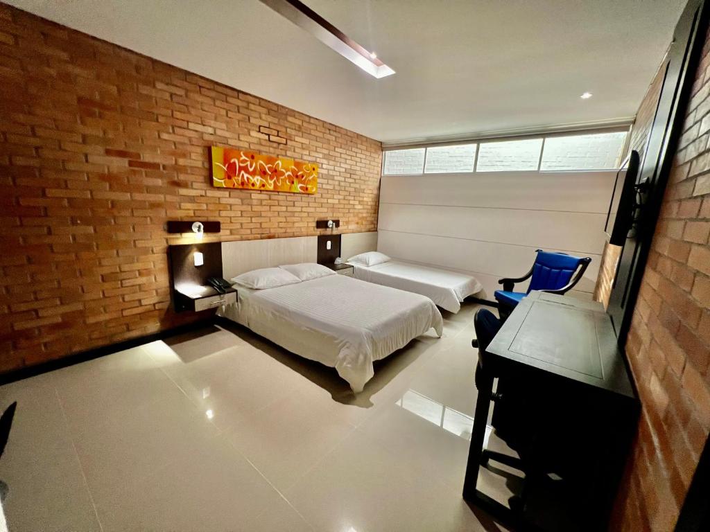 Postel nebo postele na pokoji v ubytování Hotel Toscana Oriente