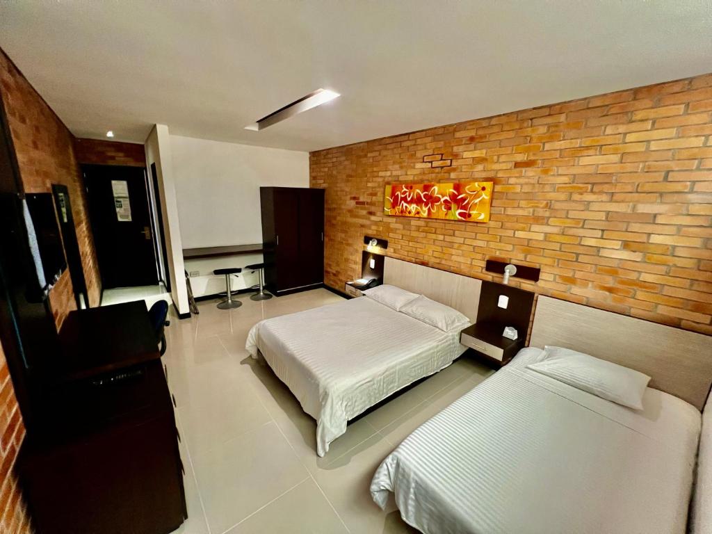 Postel nebo postele na pokoji v ubytování Hotel Toscana Oriente