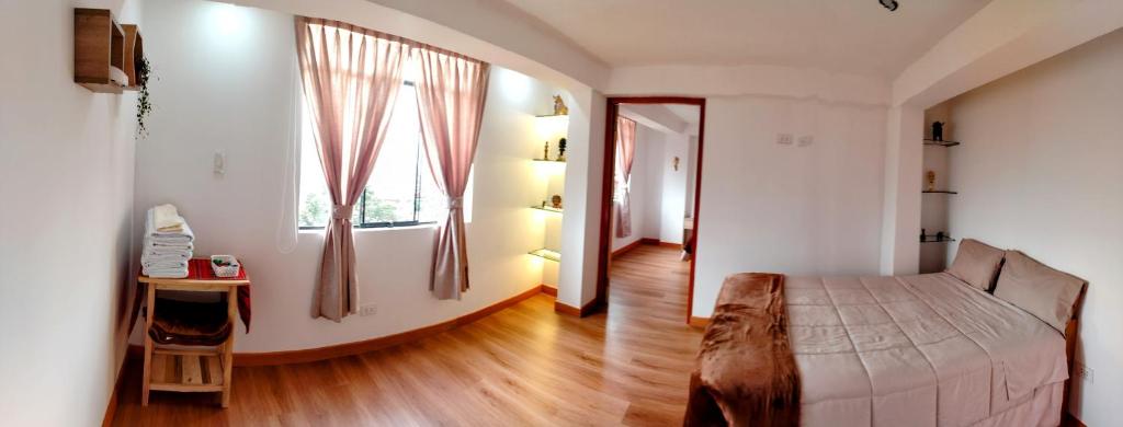Postel nebo postele na pokoji v ubytování Panoramic Cusco