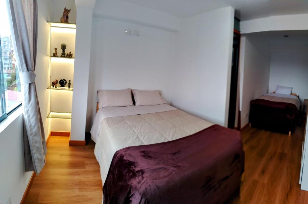 Postel nebo postele na pokoji v ubytování Panoramic Cusco