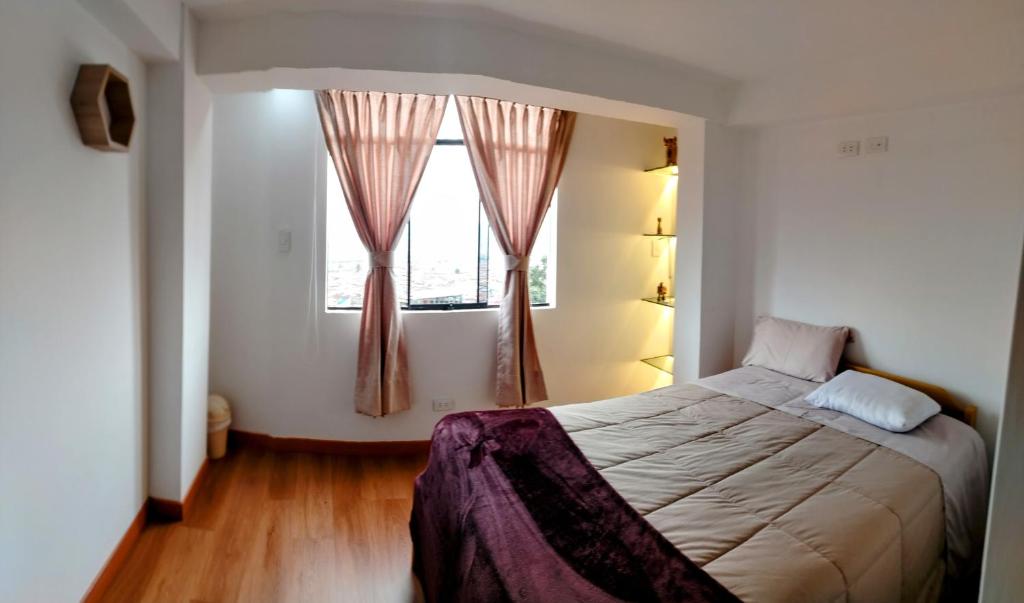 Postel nebo postele na pokoji v ubytování Panoramic Cusco
