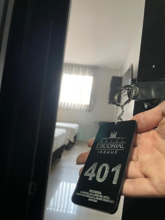 Postel nebo postele na pokoji v ubytování Hotel Escorial Ibagué
