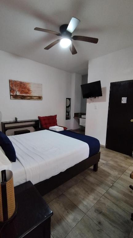 Postel nebo postele na pokoji v ubytování Hotel Gandag