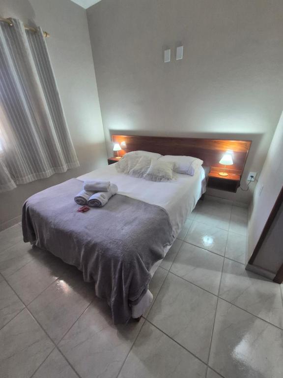 En eller flere senge i et værelse på CASA 97 completa! Horário Flexível!