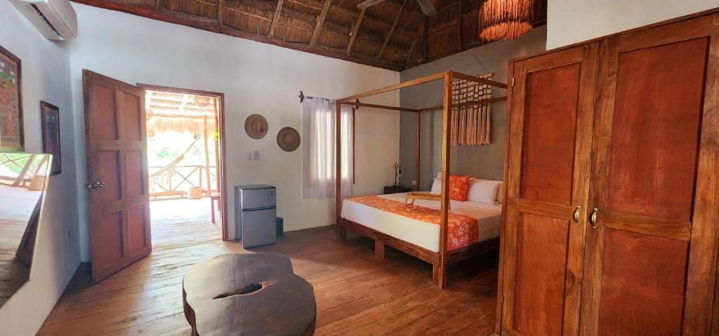 Postel nebo postele na pokoji v ubytování Hotel Kin Tulum Jungle Deluxe