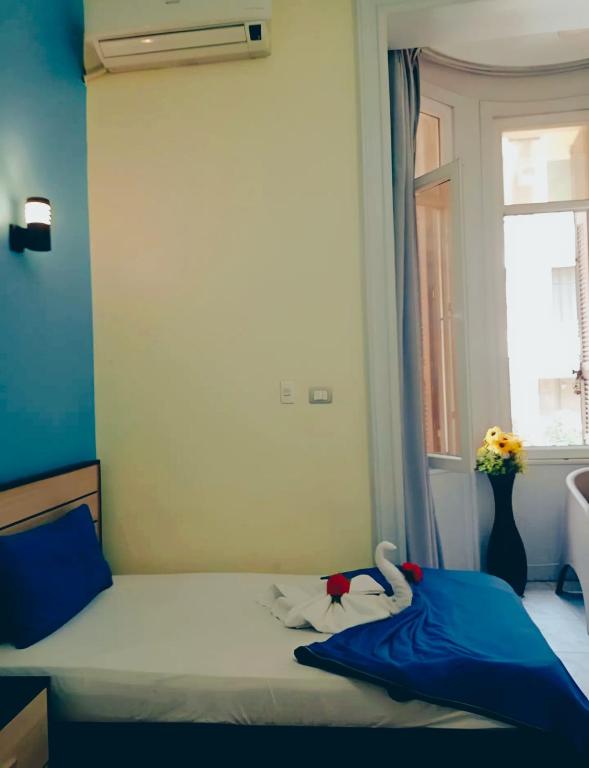 Postel nebo postele na pokoji v ubytování Hostgram Hotel