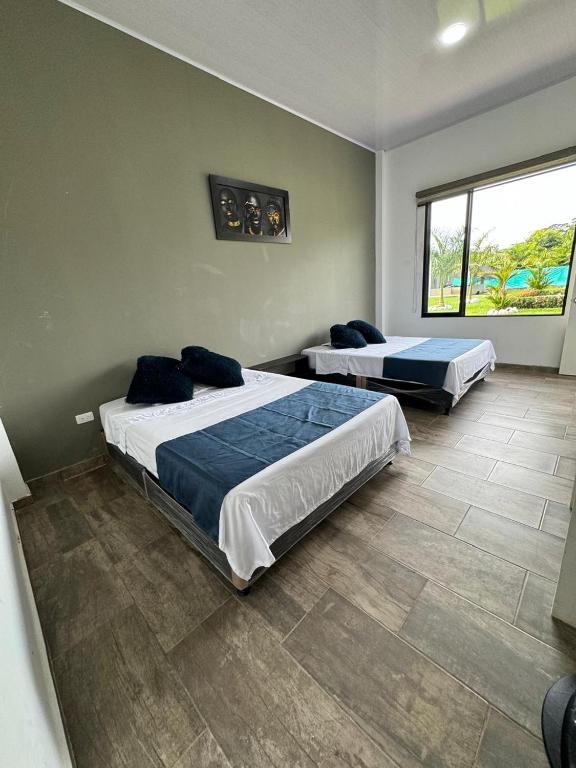 Ένα ή περισσότερα κρεβάτια σε δωμάτιο στο Quinta La Bonita Restrepo-Meta