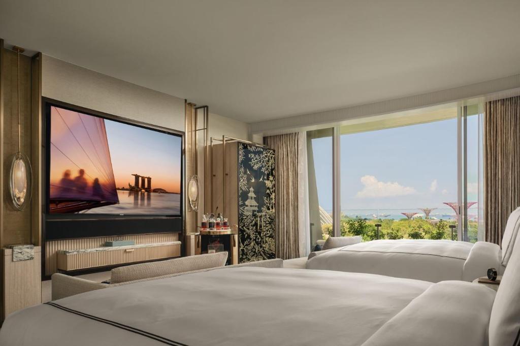 Ein Bett oder Betten in einem Zimmer der Unterkunft Marina Bay Sands