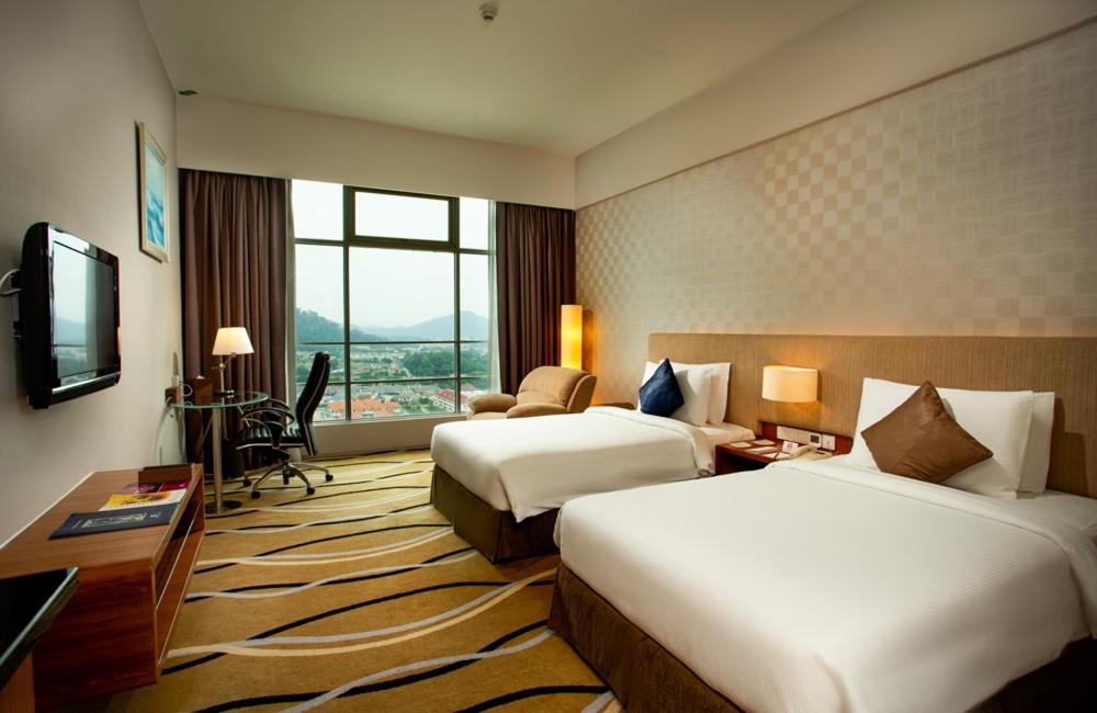 Postel nebo postele na pokoji v ubytování Zenith Hotel Kuantan
