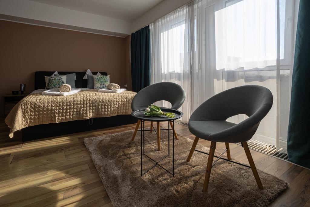 Postel nebo postele na pokoji v ubytování HelloWine Apartman II