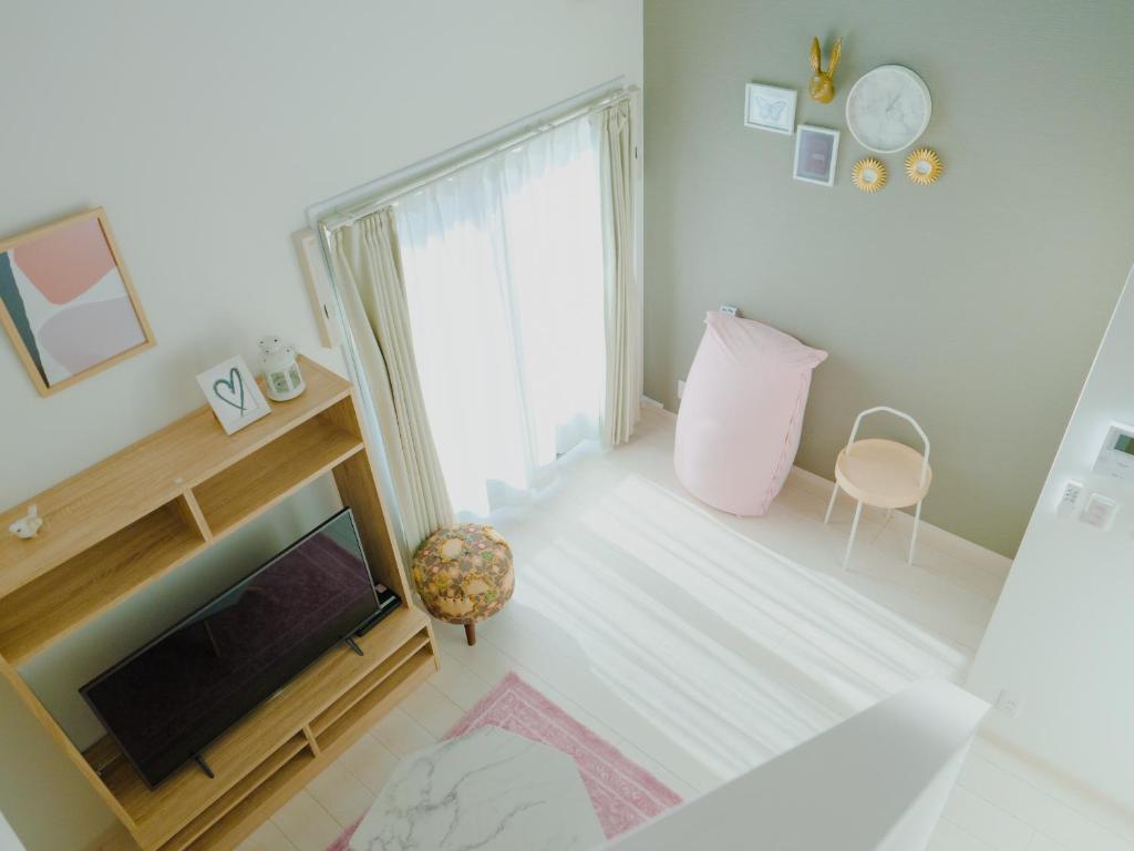 Postel nebo postele na pokoji v ubytování YOUR ROOM 熊本駅 little