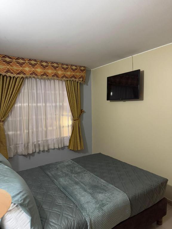 Postel nebo postele na pokoji v ubytování Hostelfc Marly