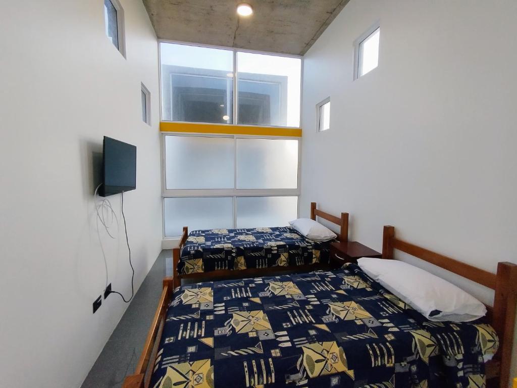 Postel nebo postele na pokoji v ubytování Puerto Enrique Apart-Hotel