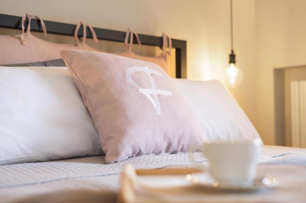 Postel nebo postele na pokoji v ubytování Camere Relais Filomare