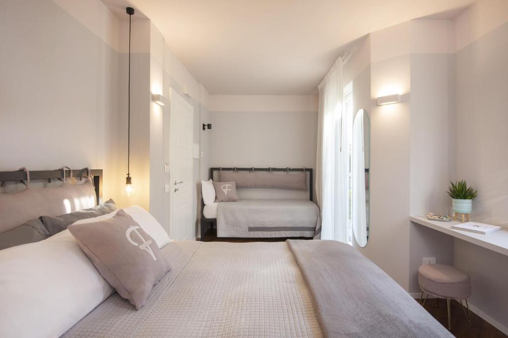 Postel nebo postele na pokoji v ubytování Camere Relais Filomare