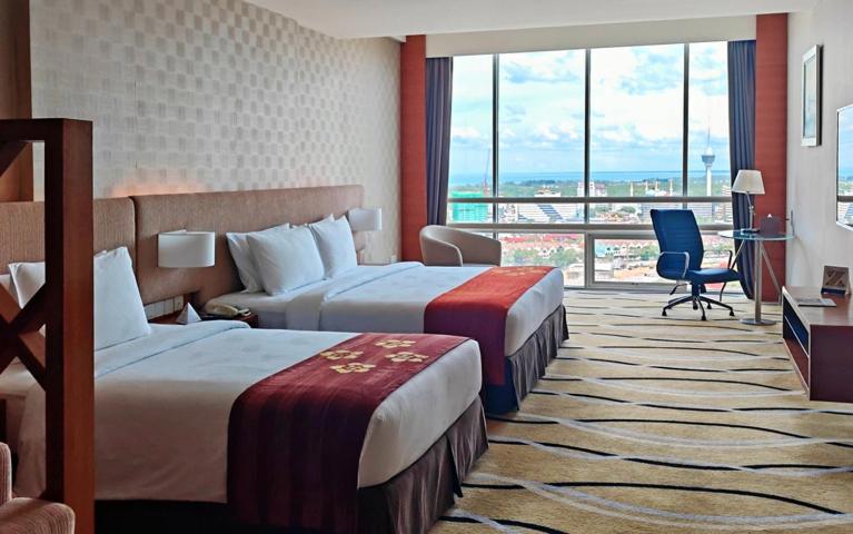 Postel nebo postele na pokoji v ubytování Zenith Hotel Kuantan