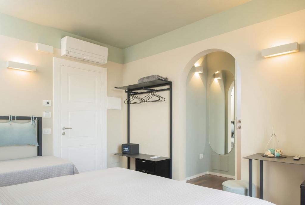 Postel nebo postele na pokoji v ubytování Camere Relais Filomare