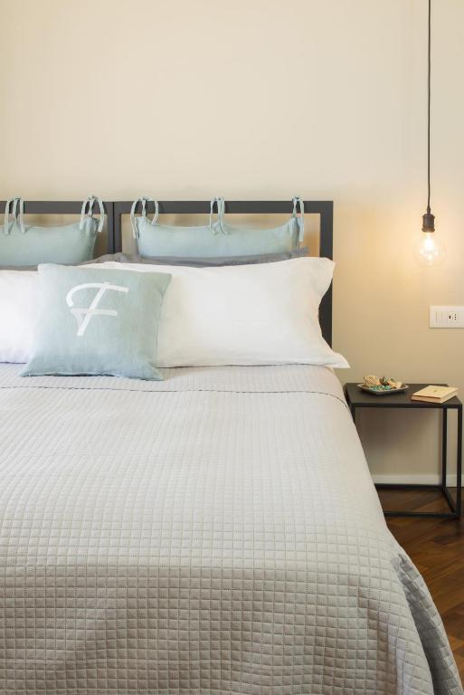 Postel nebo postele na pokoji v ubytování Camere Relais Filomare