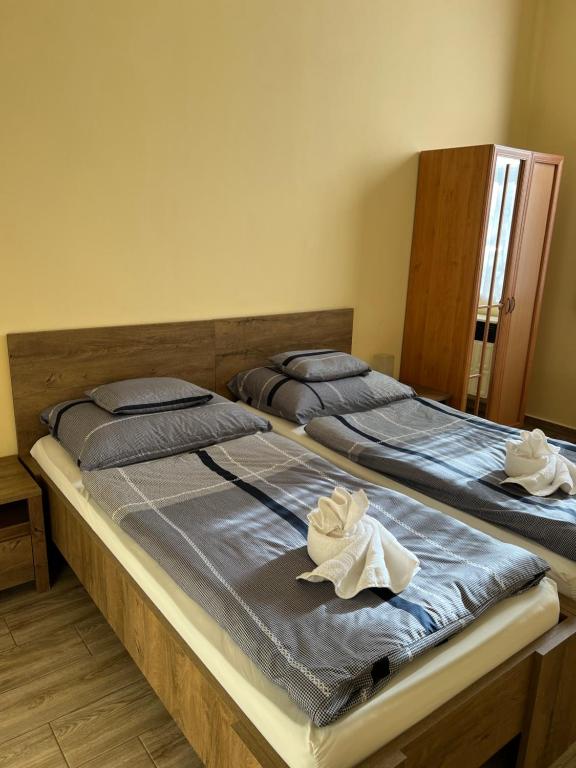 Postel nebo postele na pokoji v ubytování Helga Apartman