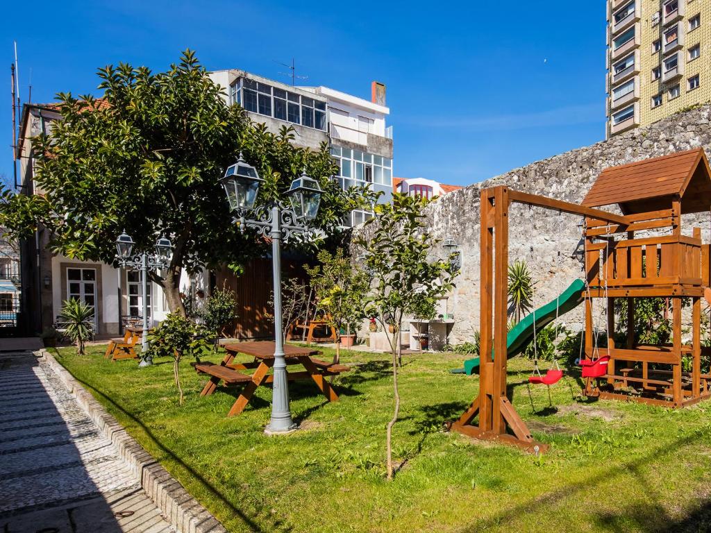 a park with a picnic table and a playground at Pedra Iberica in Porto