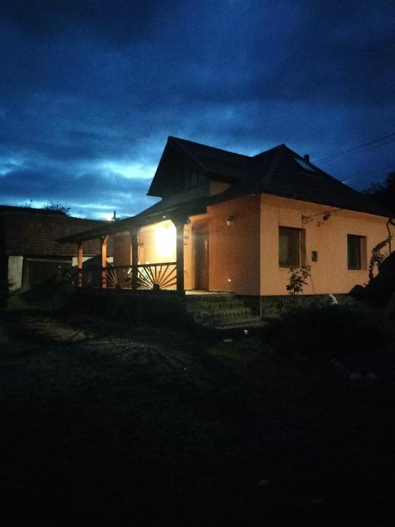 a house at night with the lights on at Casa Maria in Sarmizegetusa