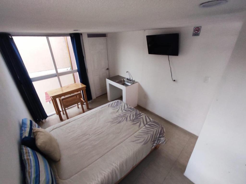 Letto o letti in una camera di Hotelito Ejido San Ale