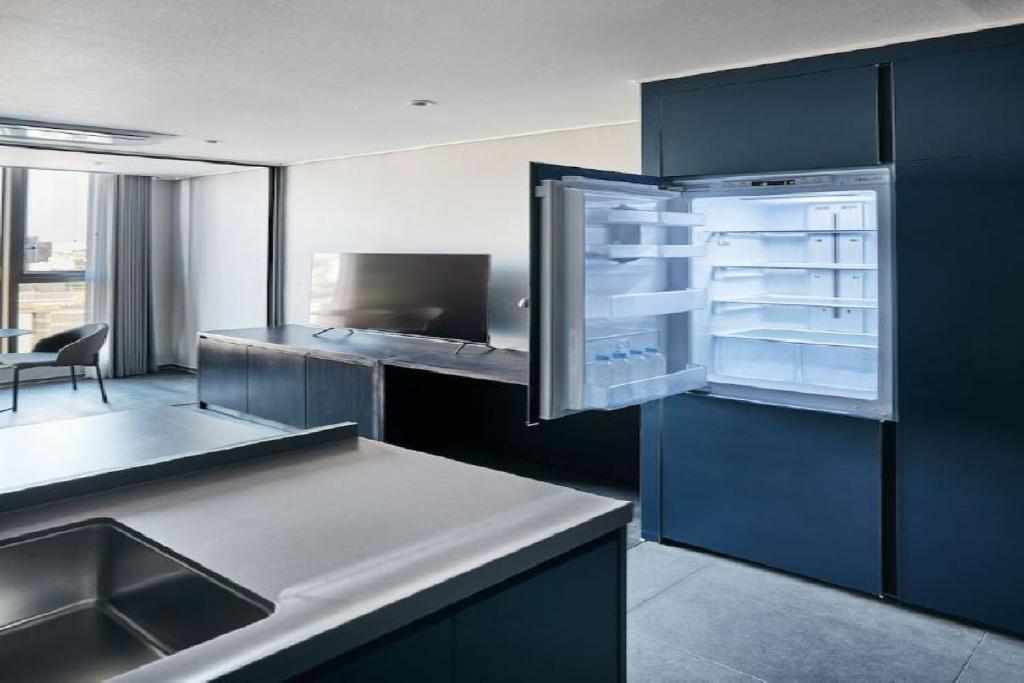 Kuchyň nebo kuchyňský kout v ubytování Homes Stay Myeongdong