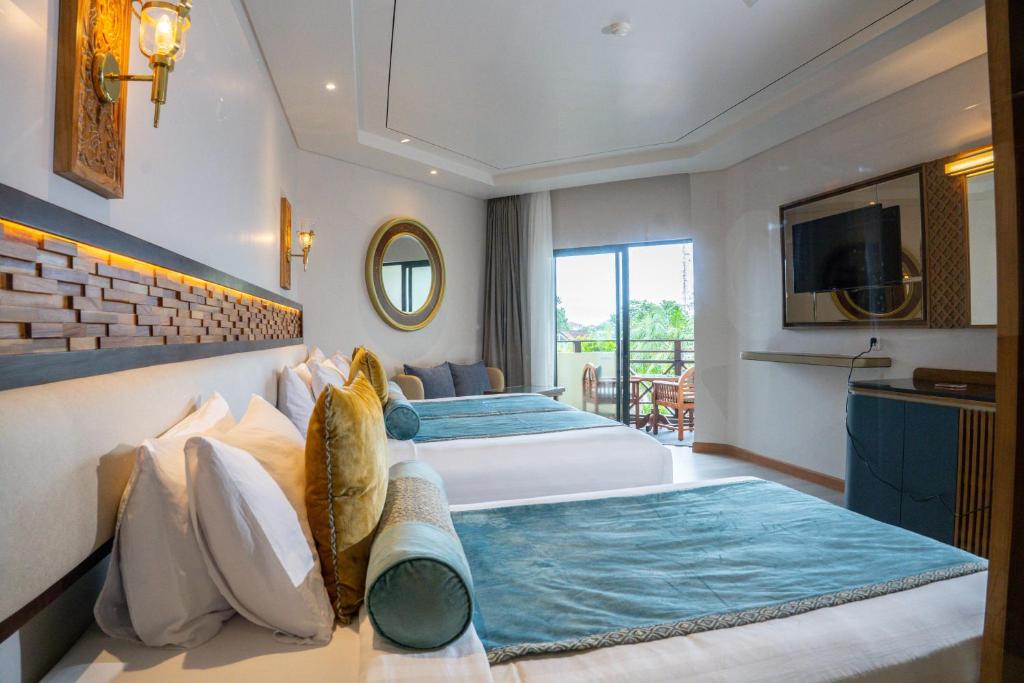 Postel nebo postele na pokoji v ubytování Grand Mirage Resort & Thalasso Bali