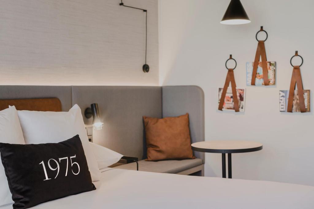 Postel nebo postele na pokoji v ubytování Hotel Dimar