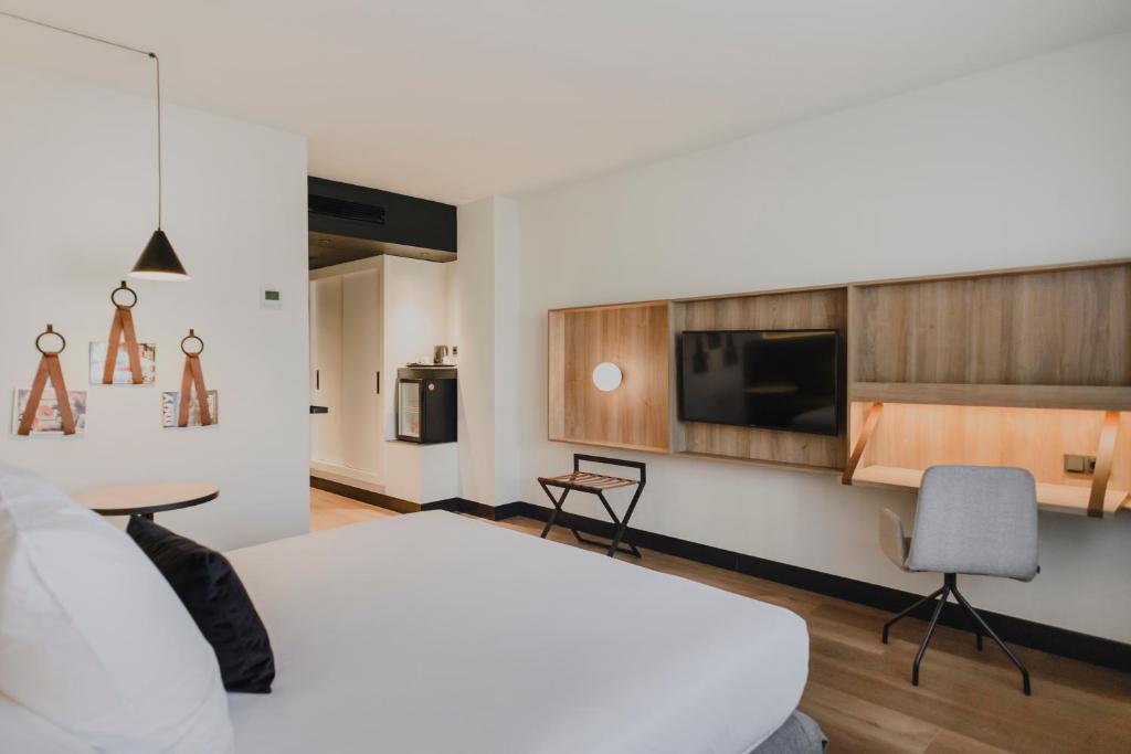 TV a/nebo společenská místnost v ubytování Hotel Dimar
