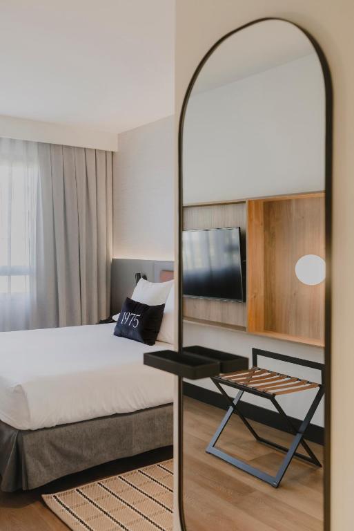 Postel nebo postele na pokoji v ubytování Hotel Dimar