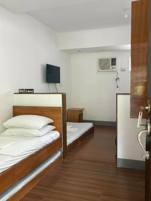 Postel nebo postele na pokoji v ubytování Dubay Panglao Beachfront Resort