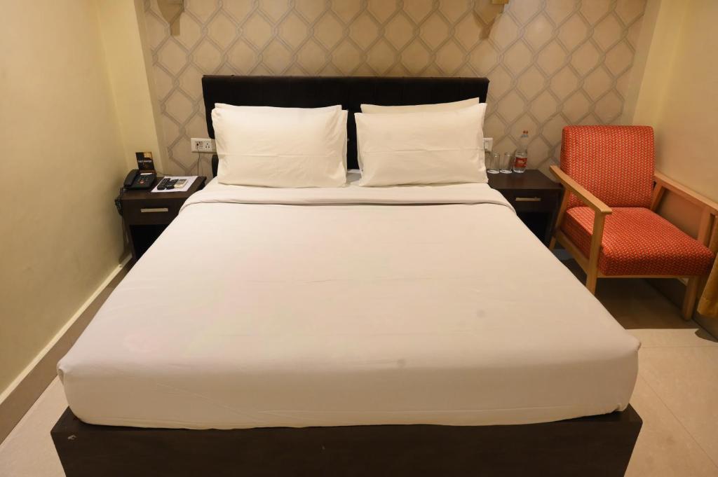 Postel nebo postele na pokoji v ubytování The Citi Residenci Hotel, Bidhannagar