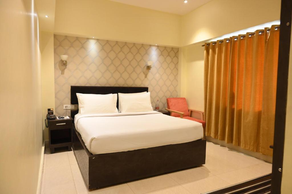 Postel nebo postele na pokoji v ubytování The Citi Residenci Hotel, Bidhannagar