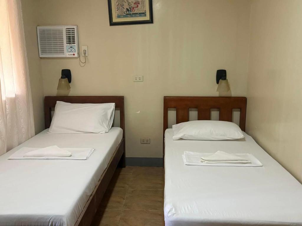 Postel nebo postele na pokoji v ubytování Dubay Panglao Beachfront Resort