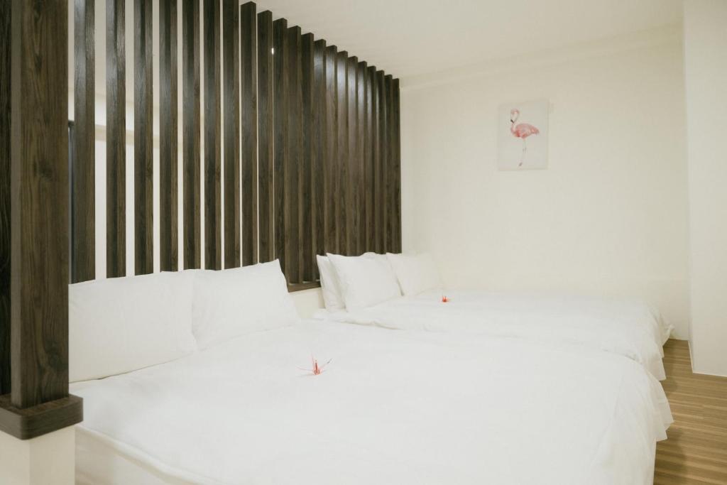 Postel nebo postele na pokoji v ubytování 金金禮寓Solis hotel