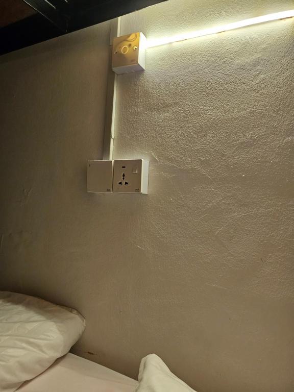 Postel nebo postele na pokoji v ubytování AeCOTEL Mingle Hostel