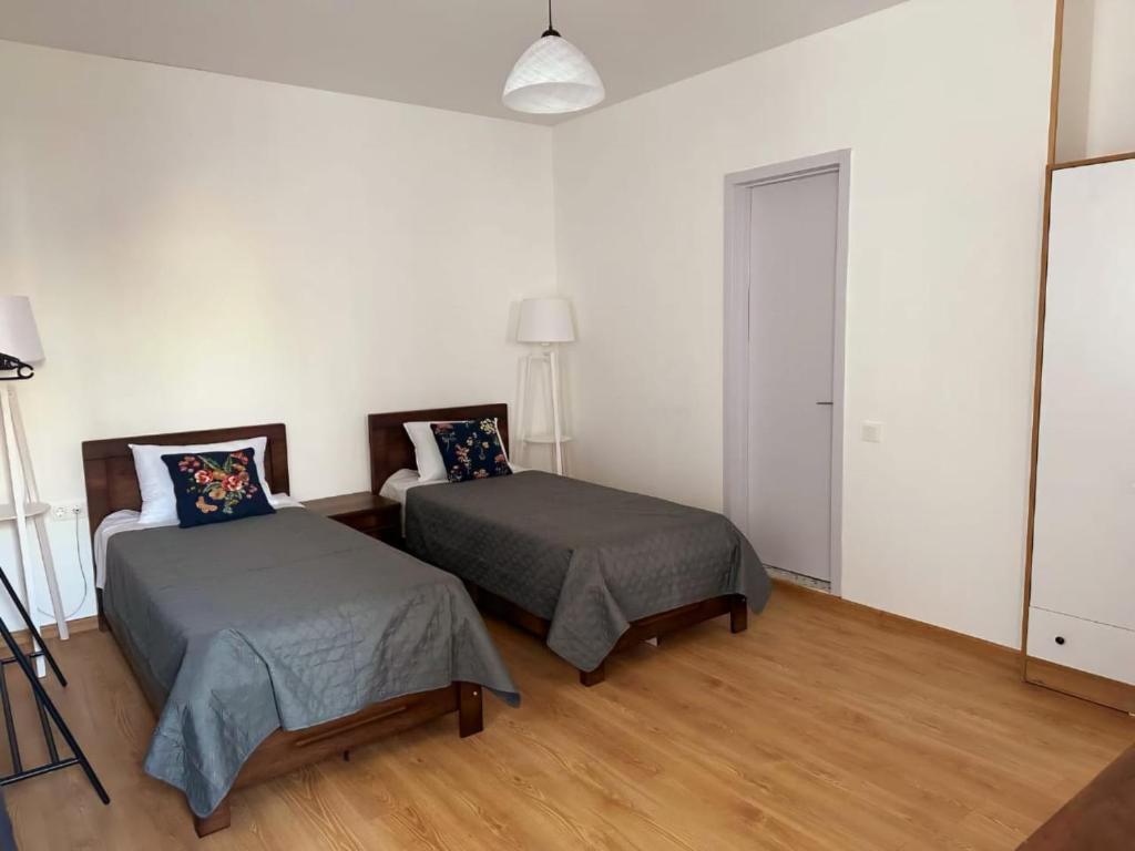 Postel nebo postele na pokoji v ubytování Hotel Home