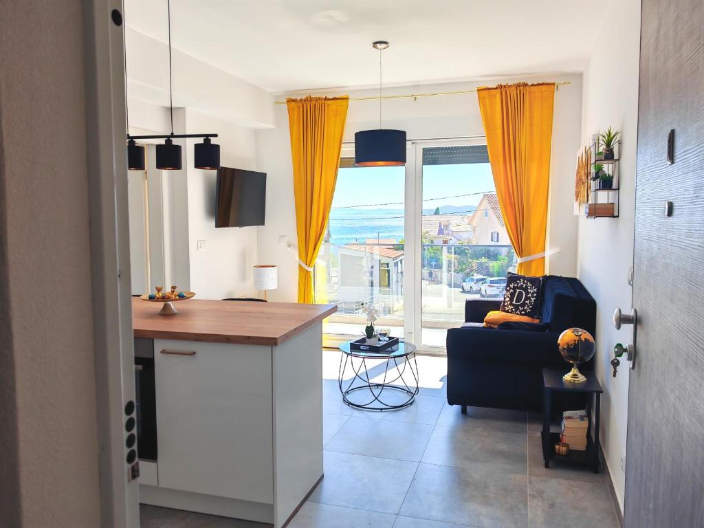 a kitchen and living room with a table and a couch at Modern Luxury Apartment Diva 1 , 4 stars, Čiovo, Okrug in Trogir