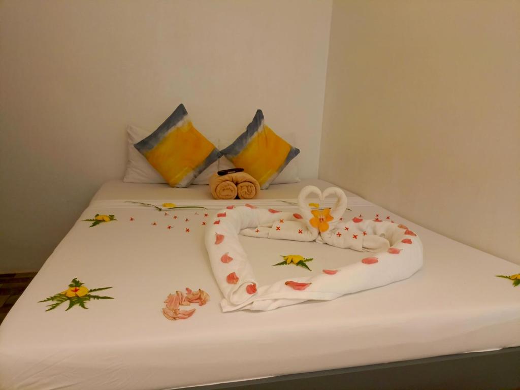 Postel nebo postele na pokoji v ubytování Palmera El Nido Inn