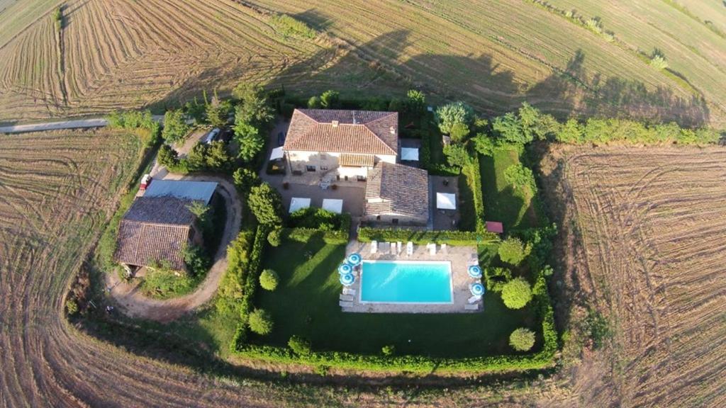 an aerial view of a estate with a swimming pool at Agriturismo il Canneto in Casole dʼElsa