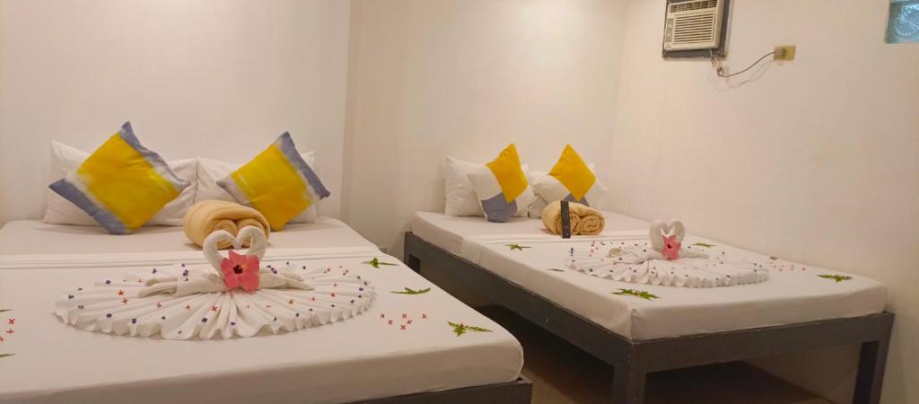Postel nebo postele na pokoji v ubytování Palmera El Nido Inn