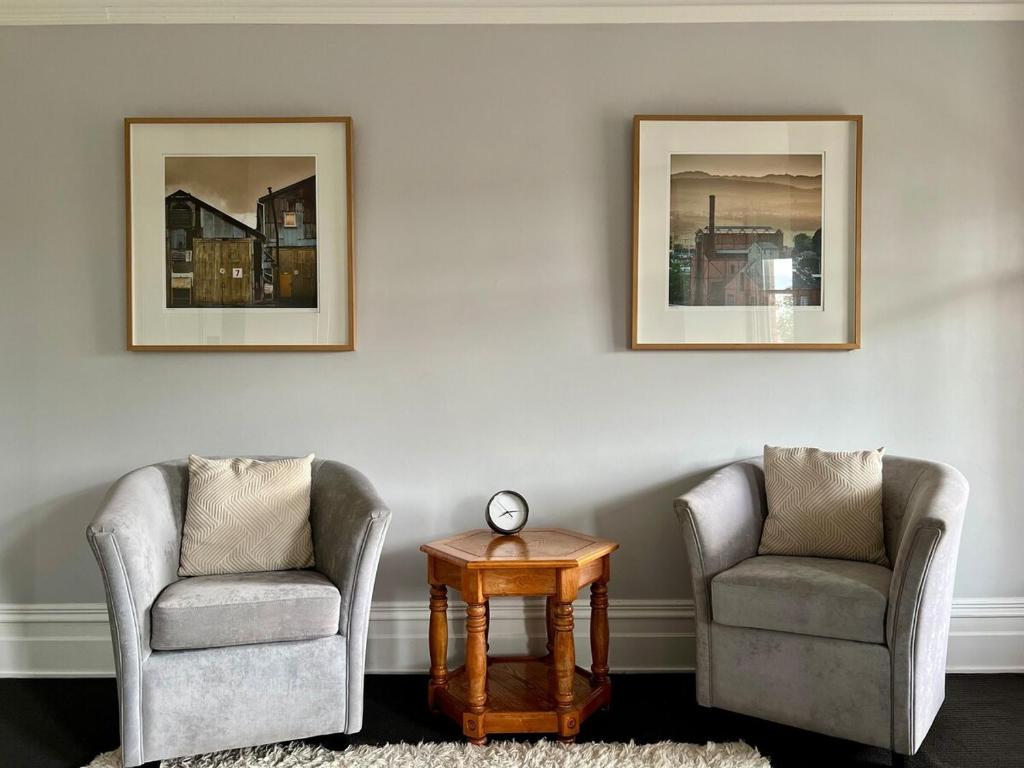 two chairs and a table in a room at Charming Heritage Home in Launceston