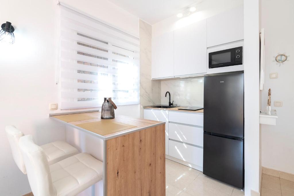 Kuchyňa alebo kuchynka v ubytovaní APARTAMENTO AÑORETa 113