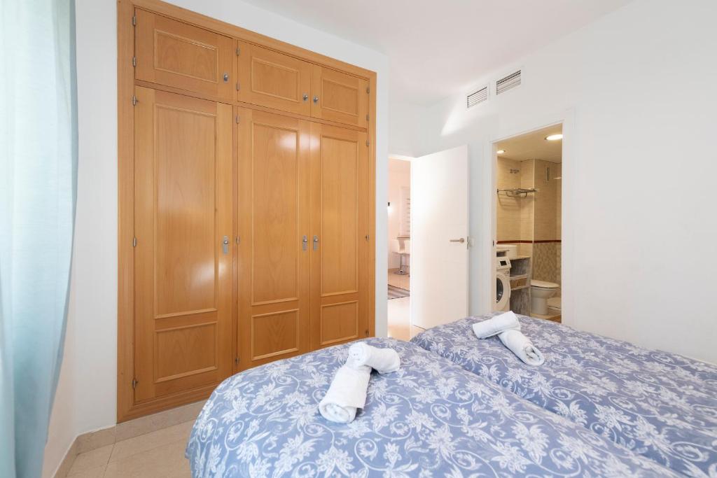 Posteľ alebo postele v izbe v ubytovaní APARTAMENTO AÑORETa 113