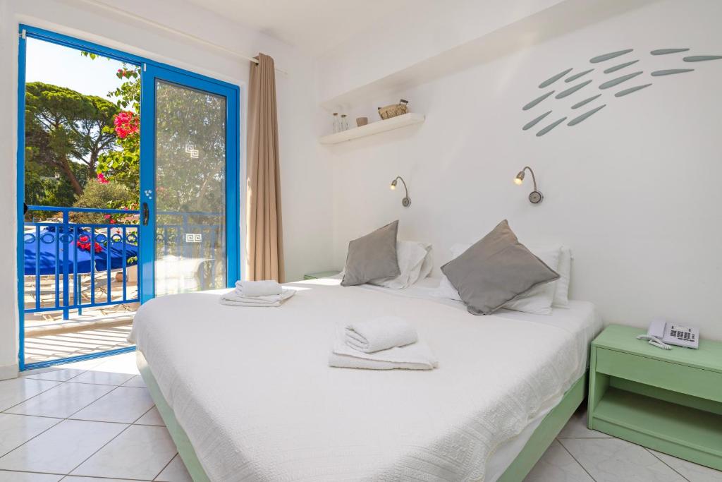 Postel nebo postele na pokoji v ubytování Hotel Nathalie